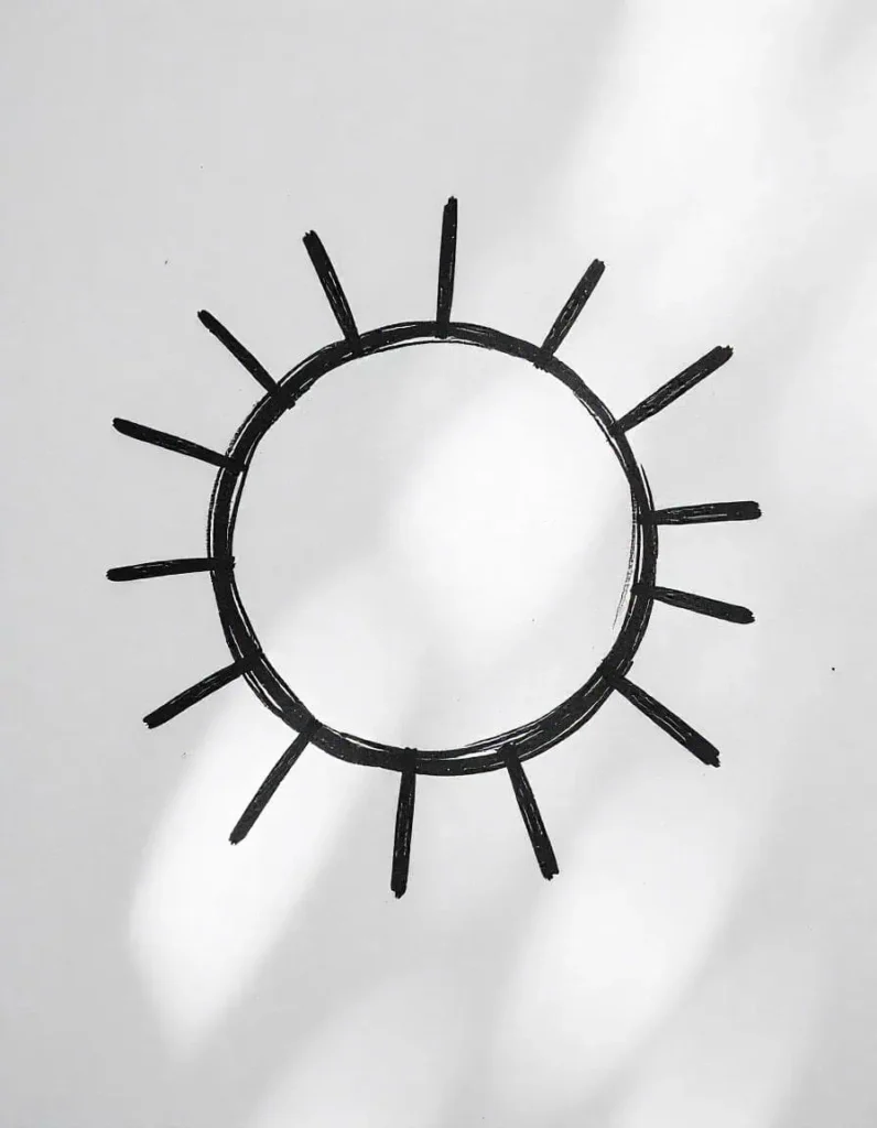 Bright sun with radiating lines an easy and cheerful drawing idea
