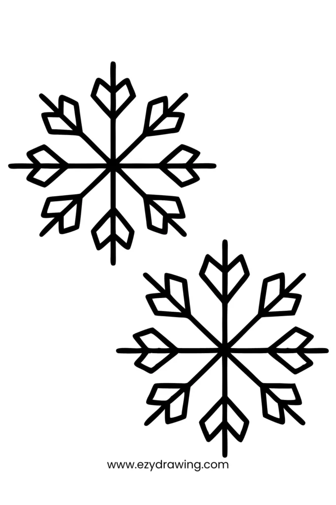 Easy snowflake drawings with clean lines—perfect winter-themed easy things to draw for all ages.